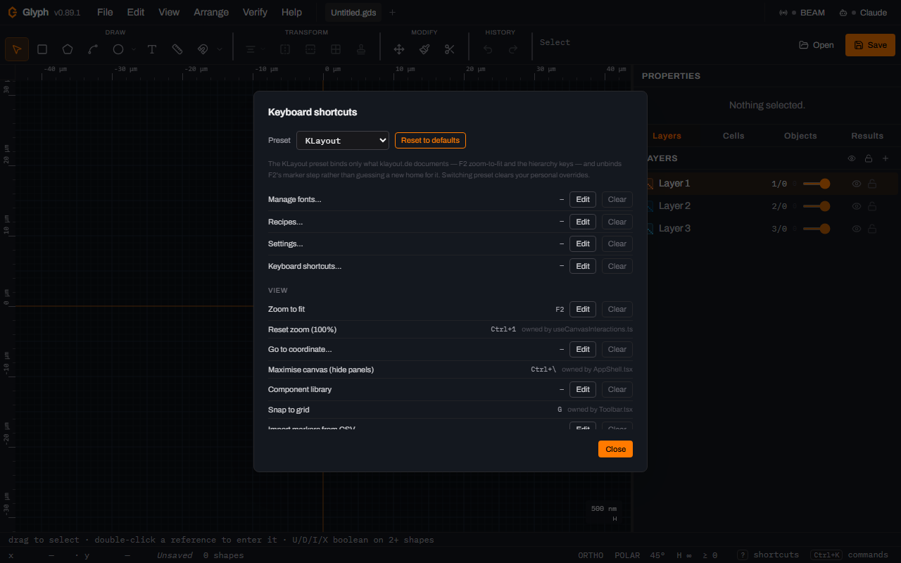 Glyph's Keyboard shortcuts dialog with Preset set to KLayout, a Reset to defaults button beside it, an explanatory note about overrides below, and the View group's Zoom to fit row showing the F2 key.